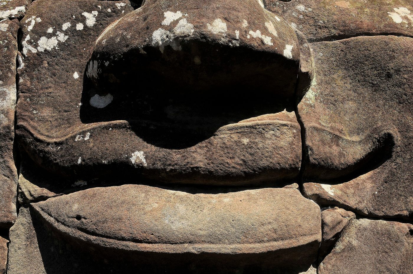 One of the smiling stone faces of the Bayon temple at Angkor Thom